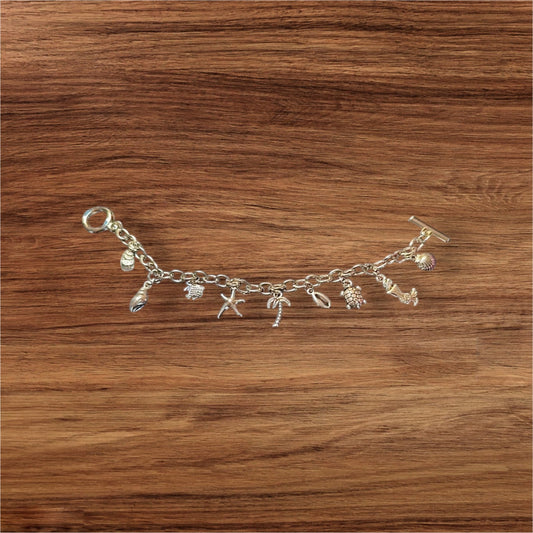 She sells sea shells by the sea shore. Charm bracelet.